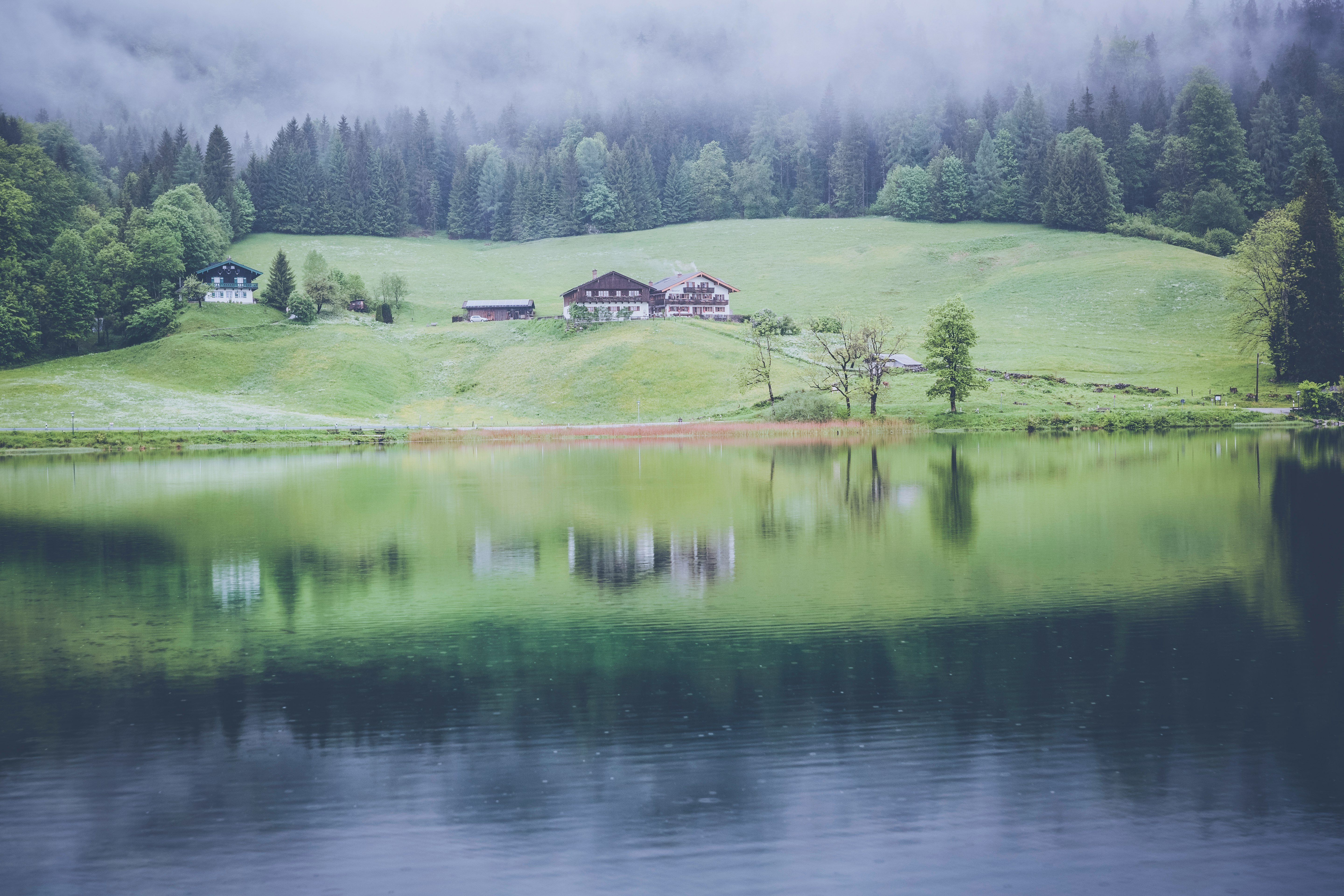 brown house near body of water